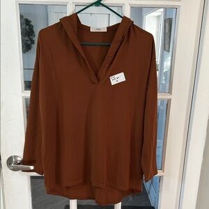 Q20.    (Rack). Rust Brown V-Neck Hoodie